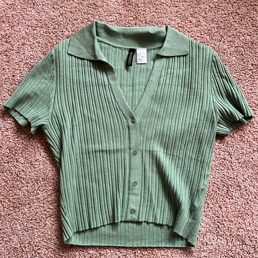 Green collared button down top.